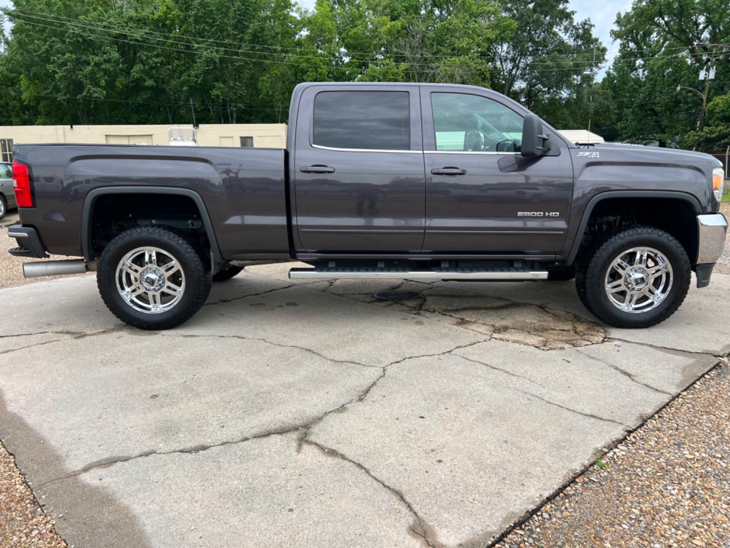 2015 Dark Grey /Black GMC Sierra 2500HD SLE (1GT12YE85FF) with an 6.6L Duramax Diesel engine, Allison Transmission transmission, located at 4520 Airline Hwy, Baton Rouge, LA, 70805, (225) 357-1497, 30.509325, -91.145432 - 2015 GMC 2500HD Crew Cab SLE 4X4 **No Accidents** 6.6L Duramax Diesel, Allison Transmission, Deleted, 200K Miles, Heated Leather, Power Windows, Locks & Mirrors, Cold A/C, Tow Pkg, Small Dent On Passenger Side Top Of Bed (See Pic). FOR INFO PLEASE CONTACT JEFF AT 225 357-1497 CHECK OUT OUR A+ RAT - Photo#4